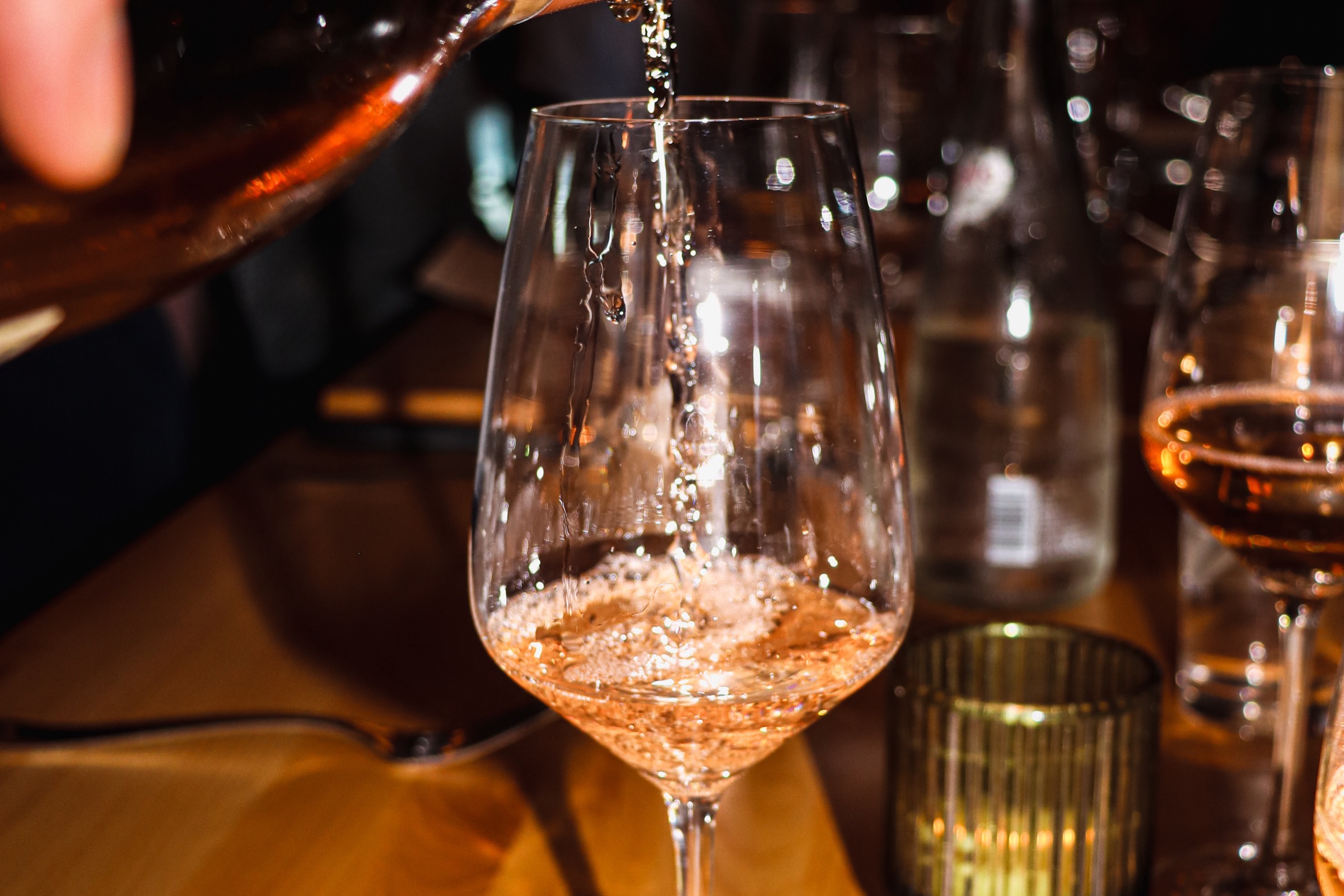 Wine being poured at the table